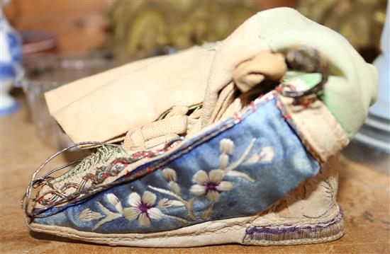 Pair of Chinese silk-embroidered leather and cloth lotus shoes